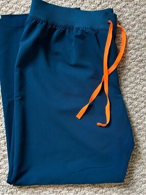 FIGS Women’s  blue scrub pants with Orange Drawstring